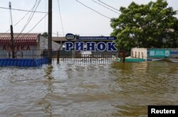 Затопленный рынок в городе Голая Пристань после прорыва дамбы Каховской ГЭС, 8 июня 2023 года